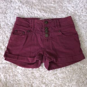 Burgundy shorts.